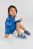 Reima Moomin Sandig UV-uimapuku Turquoise Blue lapsen yllä. - Uima-asut ja uv-vaatteet - 5200357A-6151 - 2